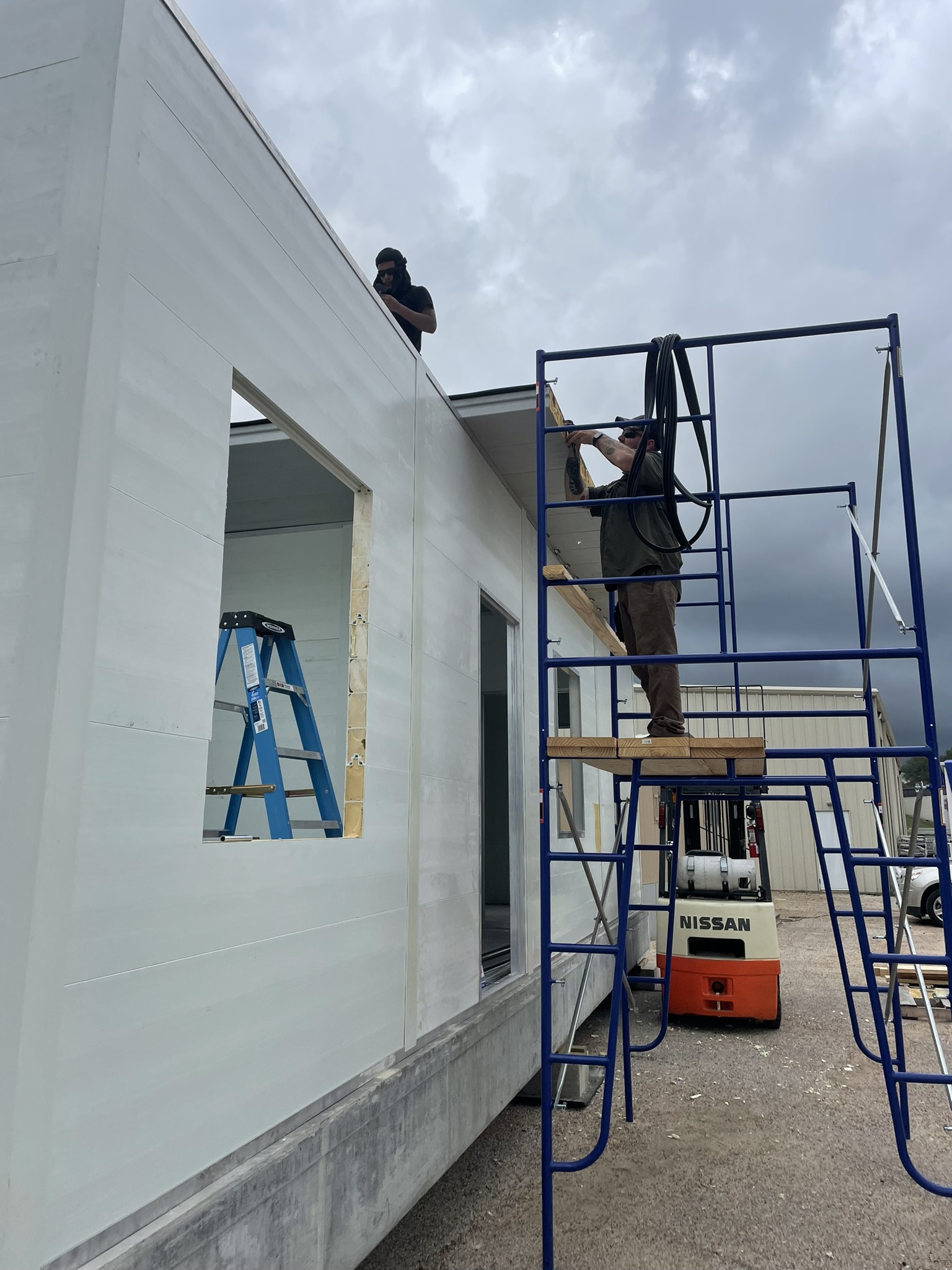 Workers building a modular home